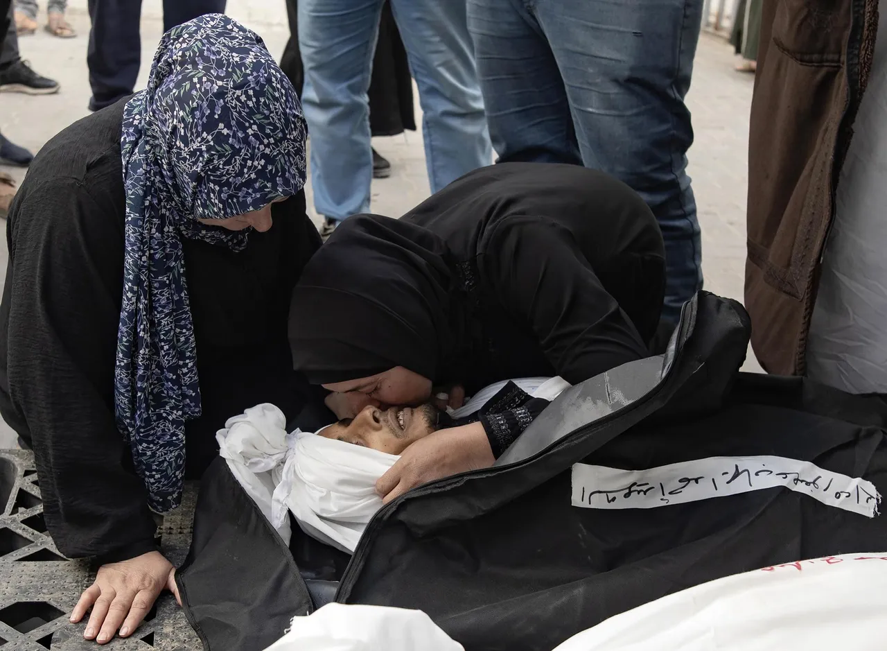 Palestinians mourn victims and check destroyed homes after Israeli air strike in Rafah