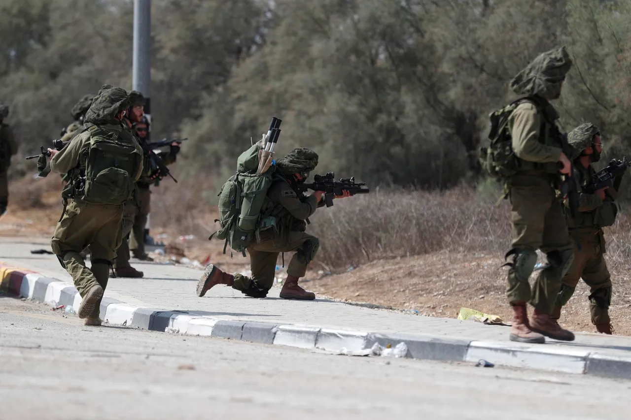 Israeli army remove bodies from Kfar Aza kibbutz