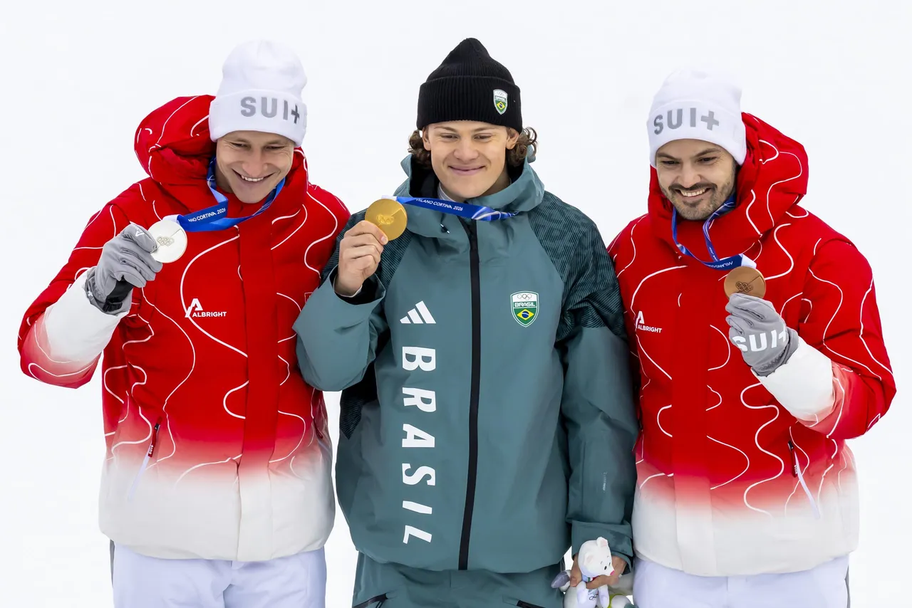 Silver medalist Marcko Odermatt of Switzerland, gold medalist Lucas Pinheiro Braathen of Brazil
