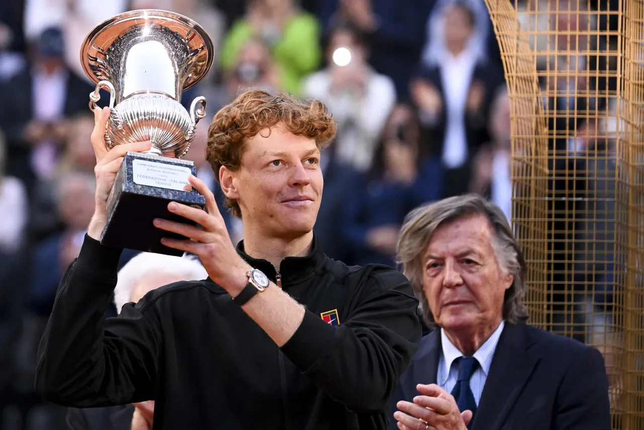 Jannik Sinner of Italy celebrates with the trophy after winning the Men's Singles final tennis