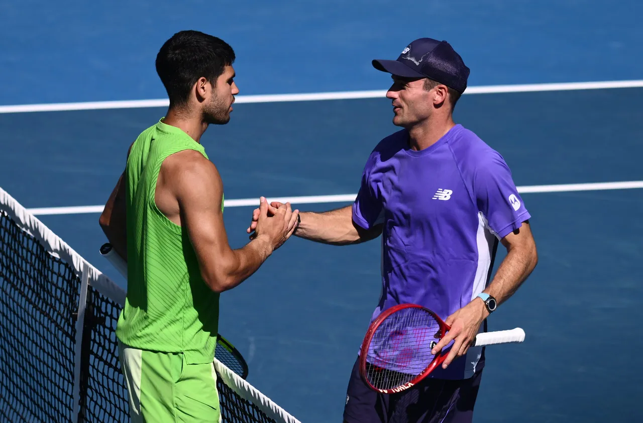 Carlos Alcaraz of Spain reacts with opponent Tommy Paul of USA
