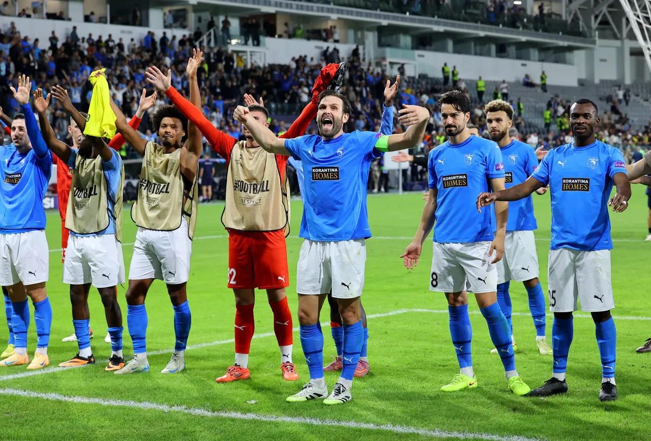Players of Pafos celebrate after the UEFA Champions League league phase match