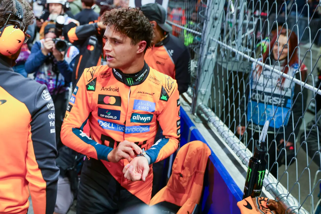 McLaren driver Lando Norris of Britain reacts on the grid prior