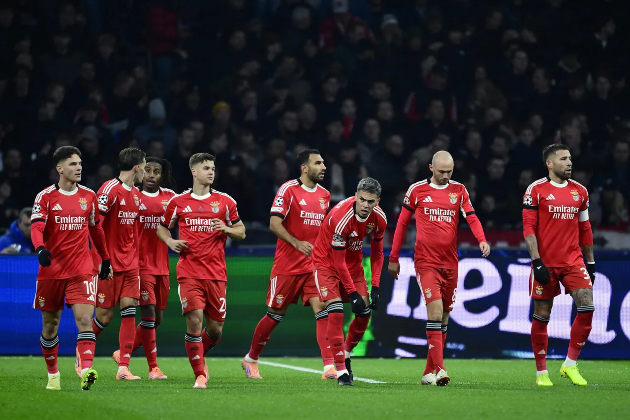Benfica players celebrate the 0-1 during the UEFA Champions League match between AFC Ajax