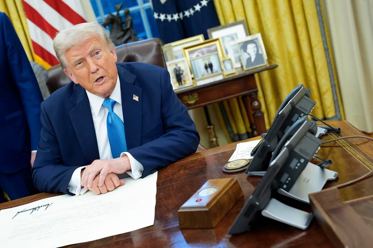 US President Trump signs executive order in the Oval Office
