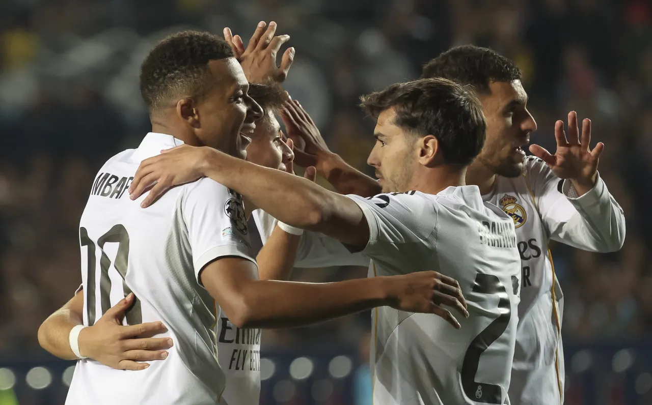 Kylian Mbappe (L) of Real Madrid celebrates with his teammates after scoring