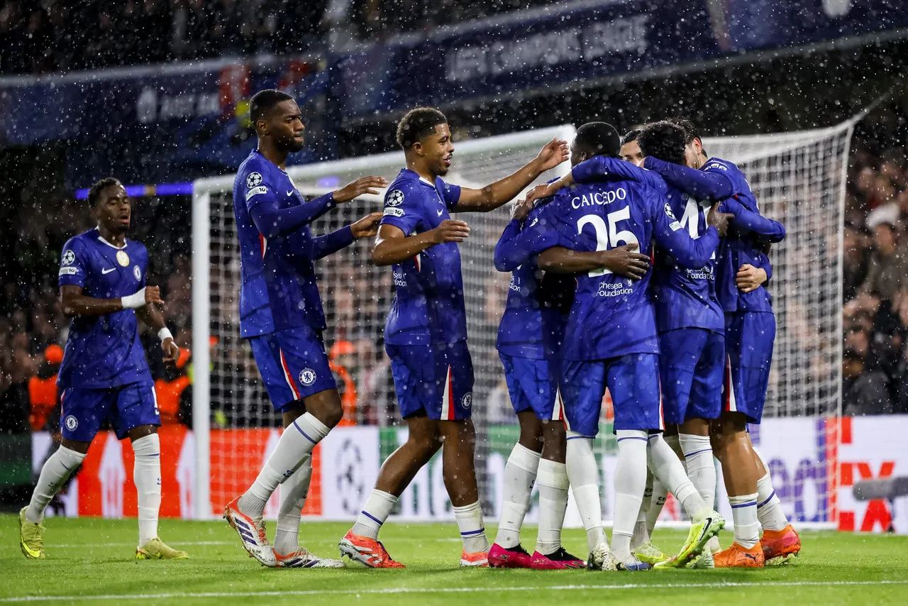 Players of Chelsea celebrate scoring the 4-1 goal from penalty during