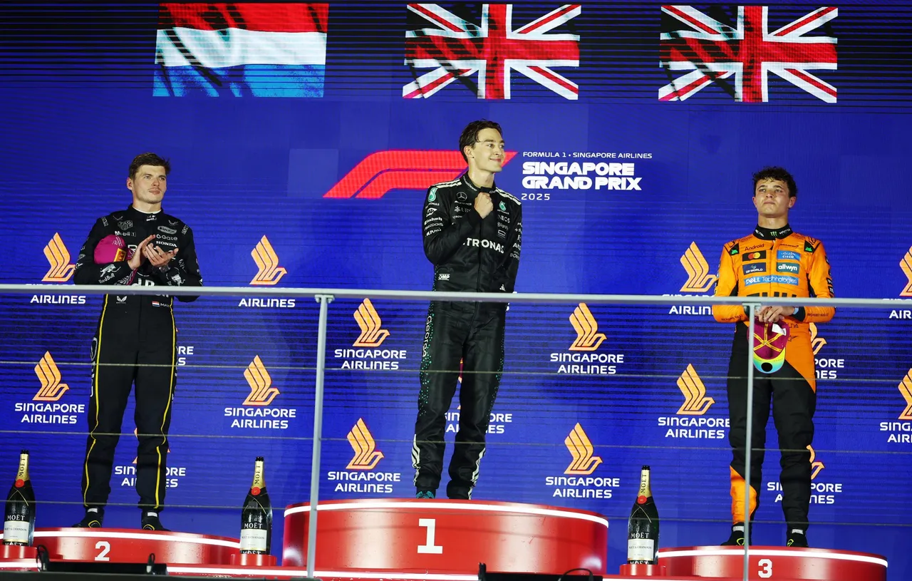 First place Mercedes driver George Russell (C) of Britain, second place Red Bull Racing