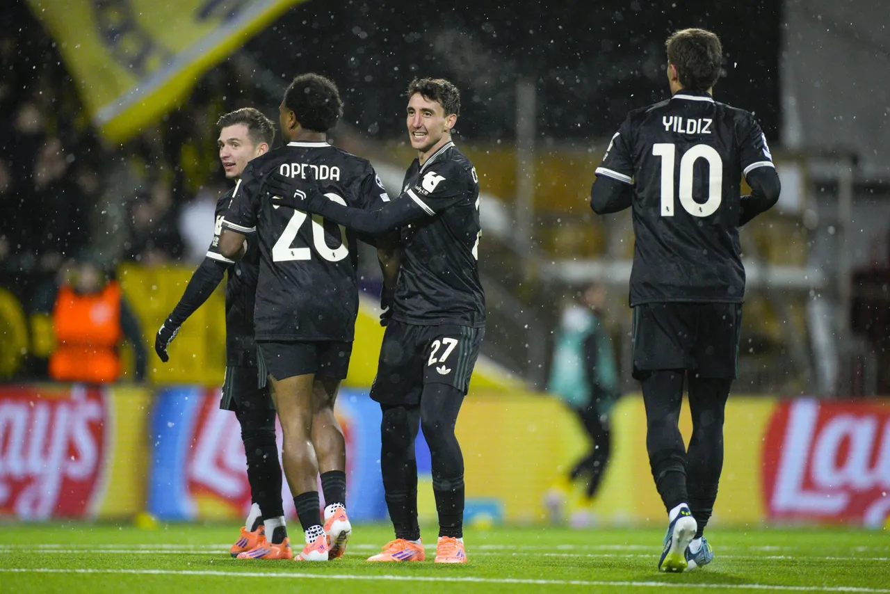 Juventus' Lois Openda (2-L) and Andrea Cambiaso (3-L) react after the 1-1 goal during the UEFA Champions
