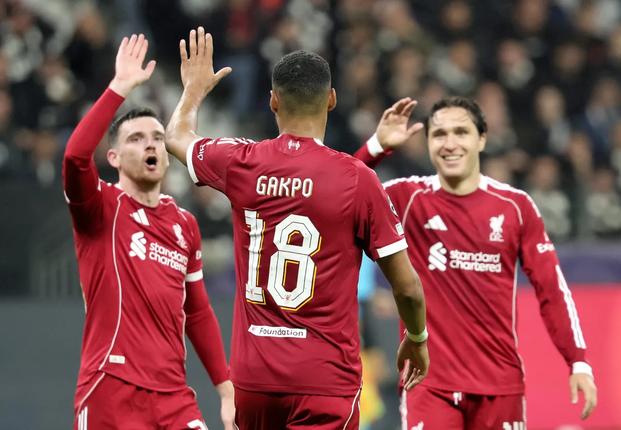 Liverpool celebrates with teanmmates after scoring his team's 4th goal during the UEFA Champions League