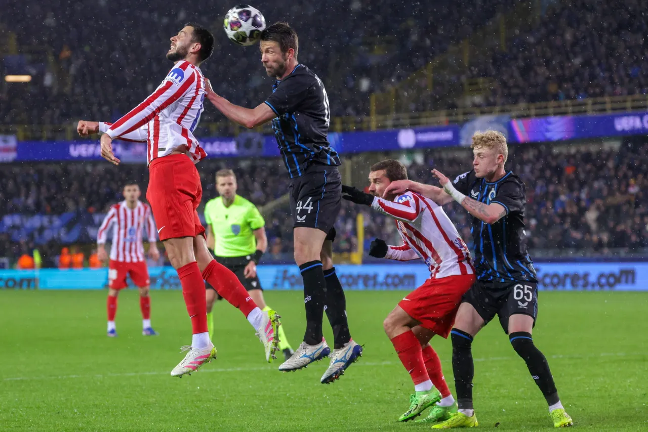 David Hancko of Atletico (L) and Brandon Mechele of Club Brugge vie for the ball during the UEFA Champions League play-offs 1st leg match between Club Brugge KV and Atletico Madrid, in Bruges