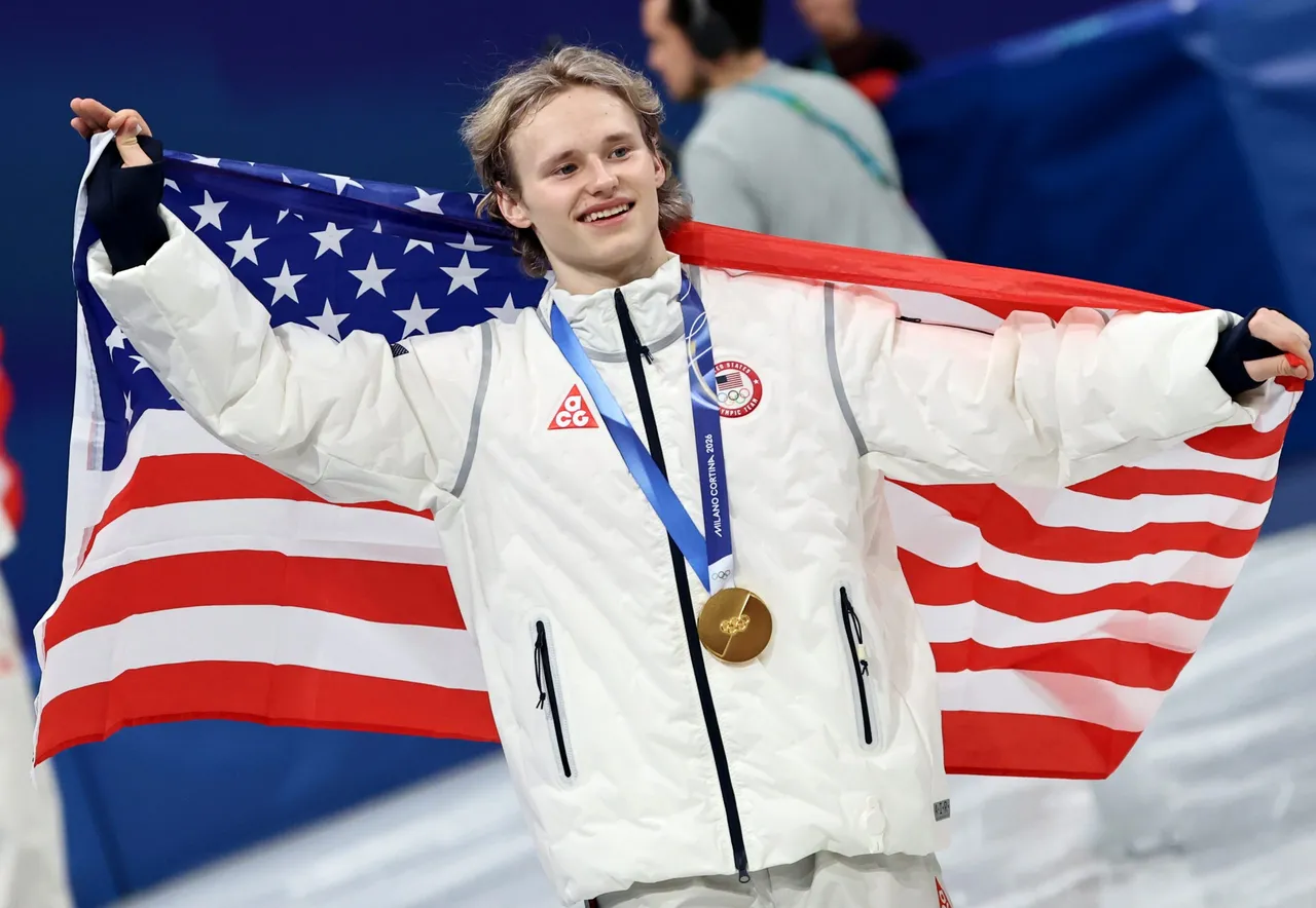 Ilia Malinin, gold medalist from team USA celebrates after the medal ceremony
