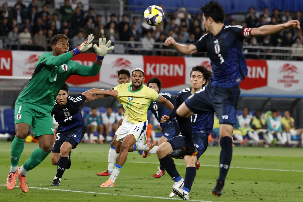 Brazil’s Joelinton (C) competes for the ball during the international friendly soccer match between Japon