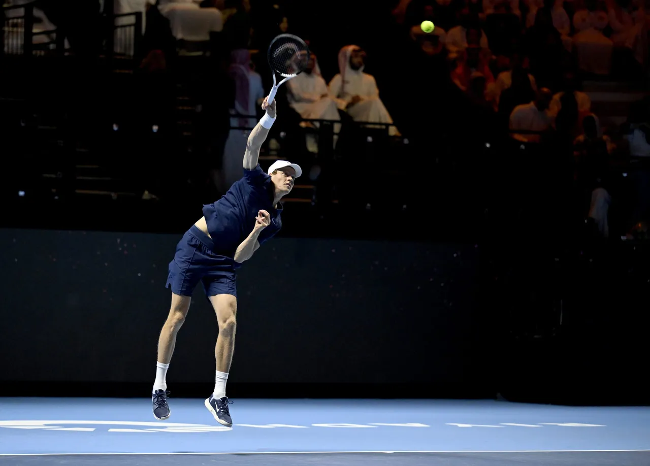Jannik Sinner of Italy serves in the final against Carlos Alcaraz of Spain