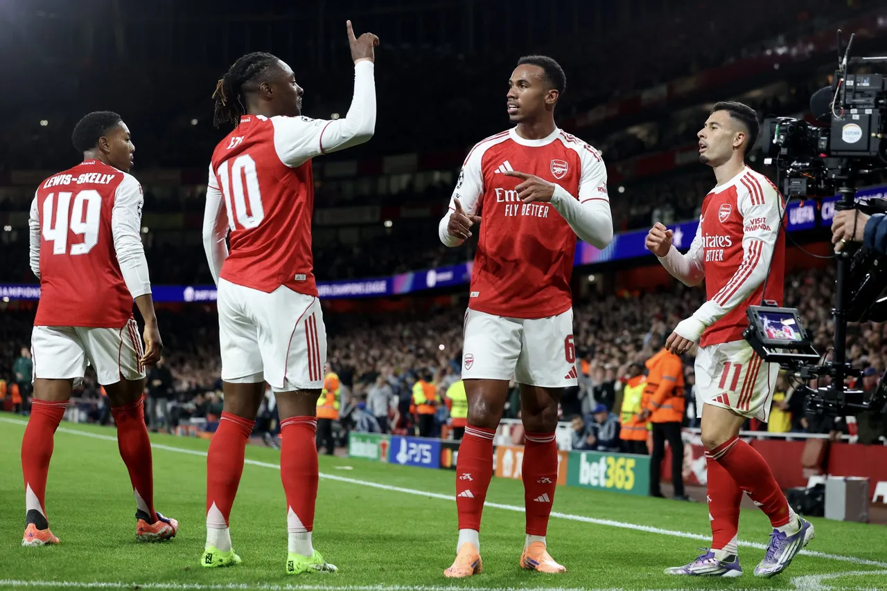 Arsenal celebrates with teammates after scoring
