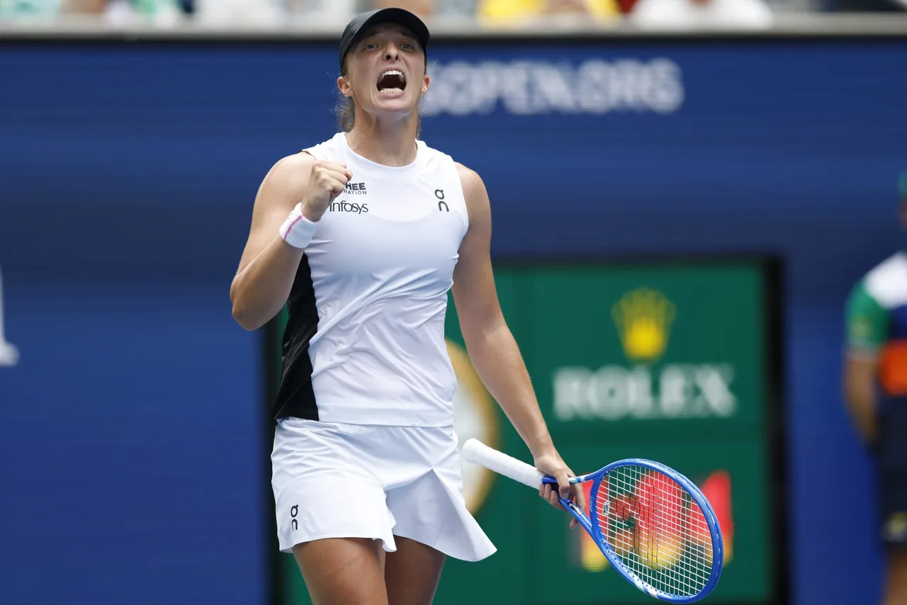 Iga Swiatek of Poland gestures after winning match point against