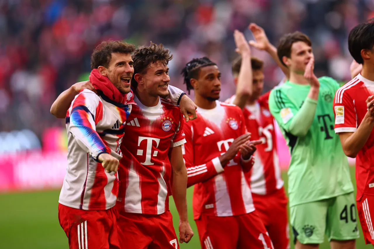 Munich players applaud to supporters after winning the German Bundesliga soccer match between FC Bayern