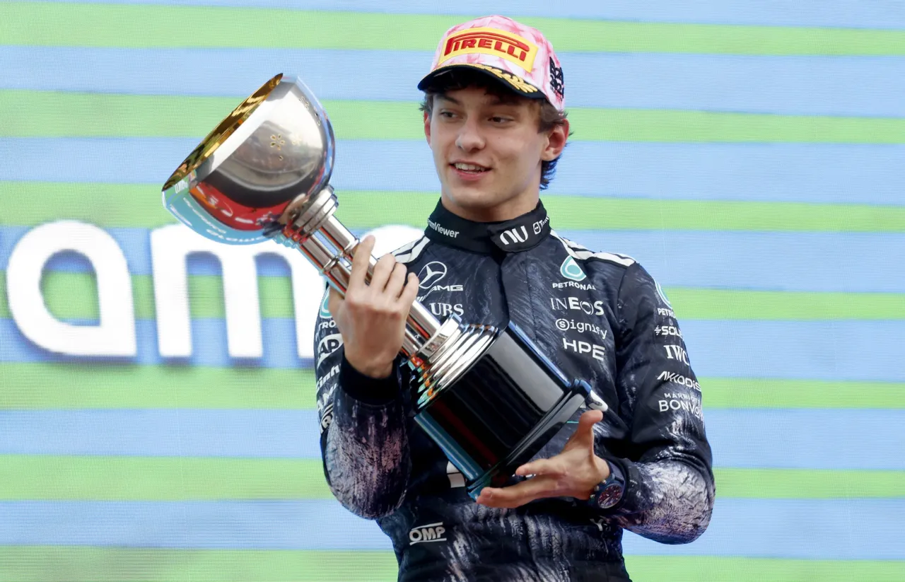 Mercedes driver Andrea Kimi Antonelli of Italy celebrates on the podium after winning the Formula 1 Japanese Grand