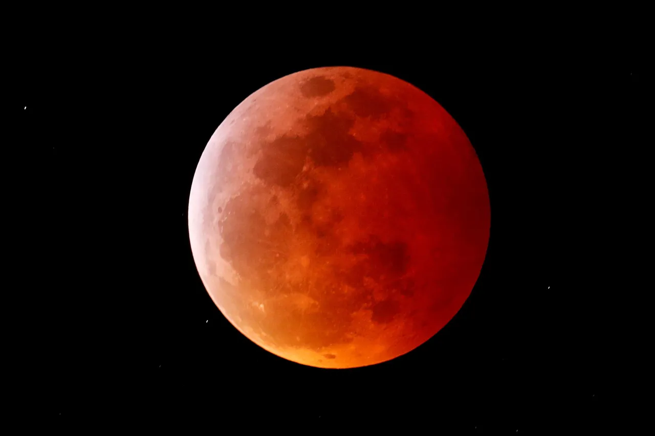 FILE PHOTO: A total lunar eclipse that is called a &#8216;Super Blood Wolf Moon&#8217; is seen from Encinitas, California