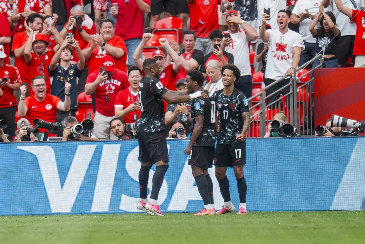 Canada forward Jonathan David (C) celebrates with teammates Cyle Larin (L) and Tajon Buchanan
