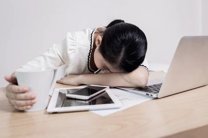 Women&#8217;s sleep and tired from work on table work in quarantine for coronavirus 2019 disease. Work from home concepts.