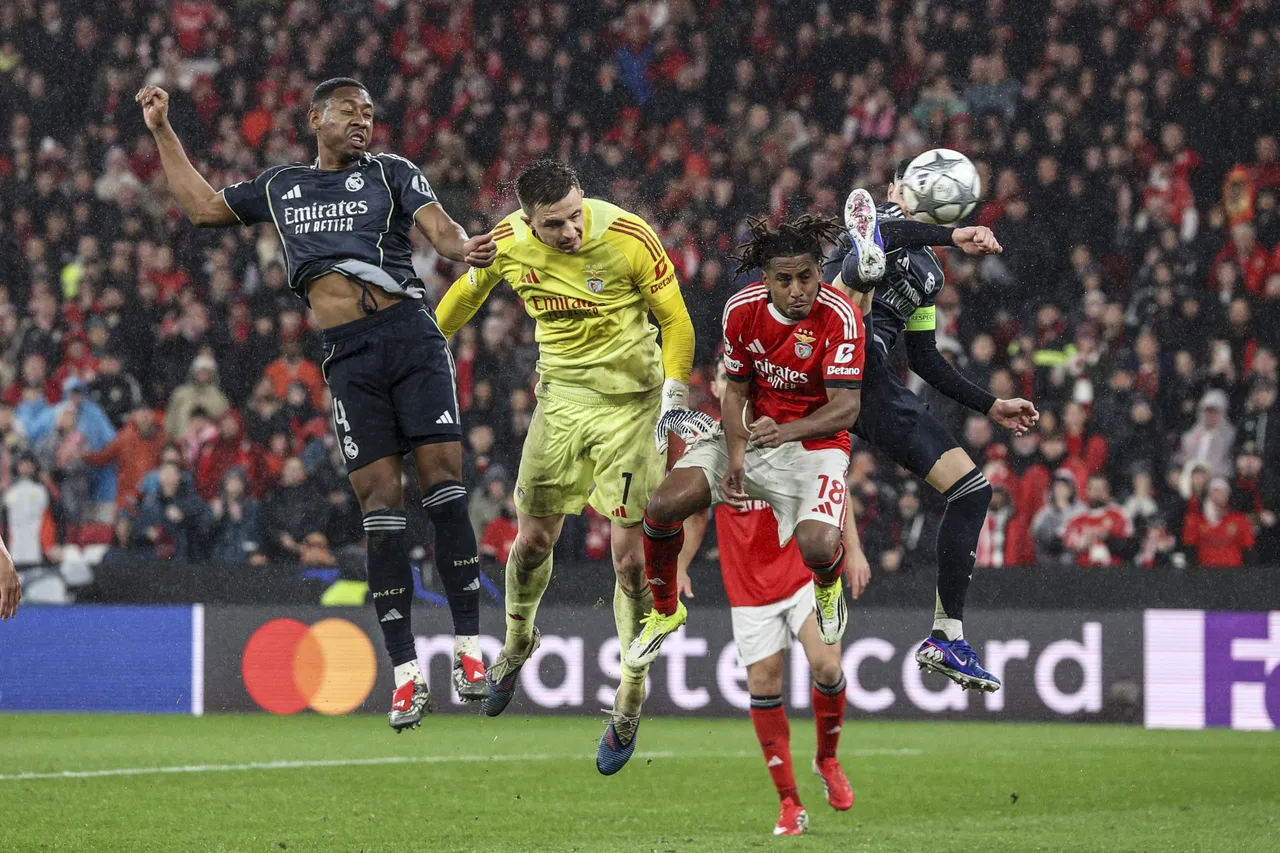 Benfica's goalkeeper Anatoliy Trubin (C) scores the 4-2 goal during the UEFA Champions League soccer match between SL Benfica and Real Madrid