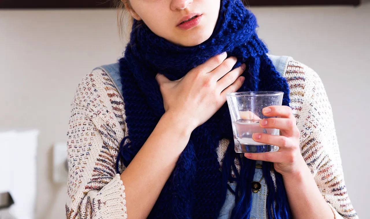 Girl with quinsy taking medicine