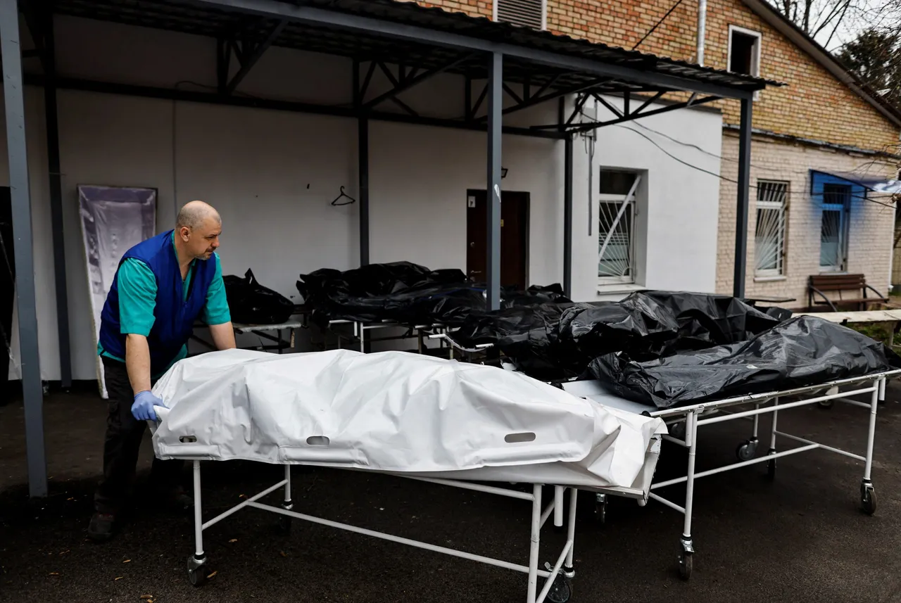Bodies waiting to be identified by their families, are seen outside the morgue in Bucha,