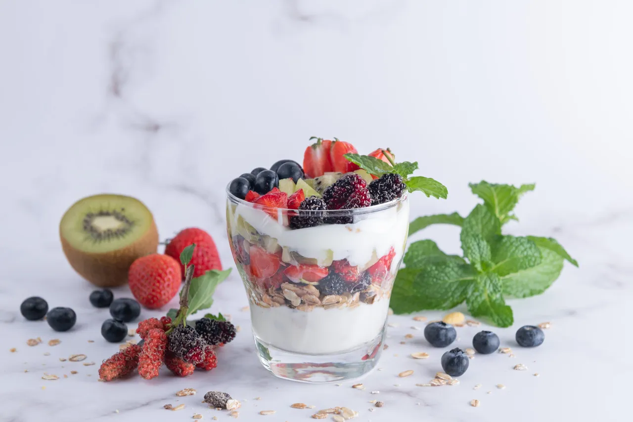 Homemade muesli, bowl of oat granola with yogurt, fresh blueberr