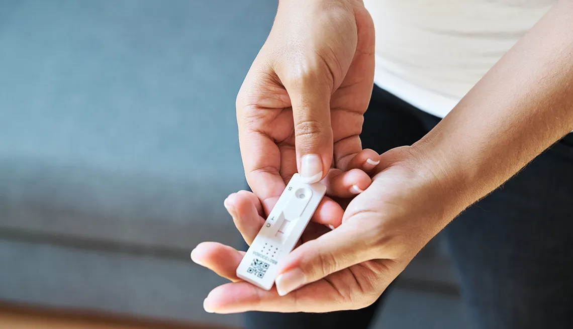 Woman taking a Covid-19 rapid antigen test at home.
