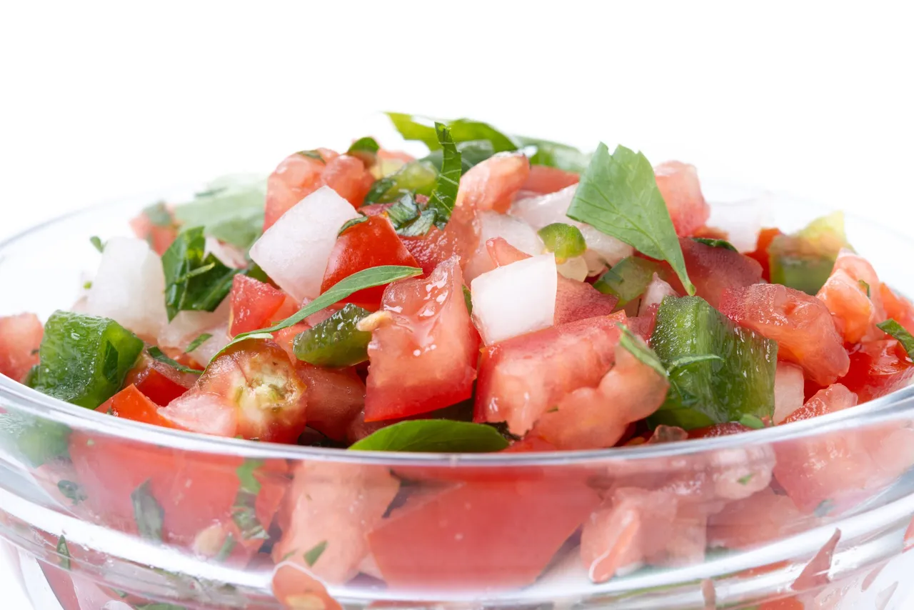 Traditional Mexican Pico de Gallo sauce isolated on white backgr