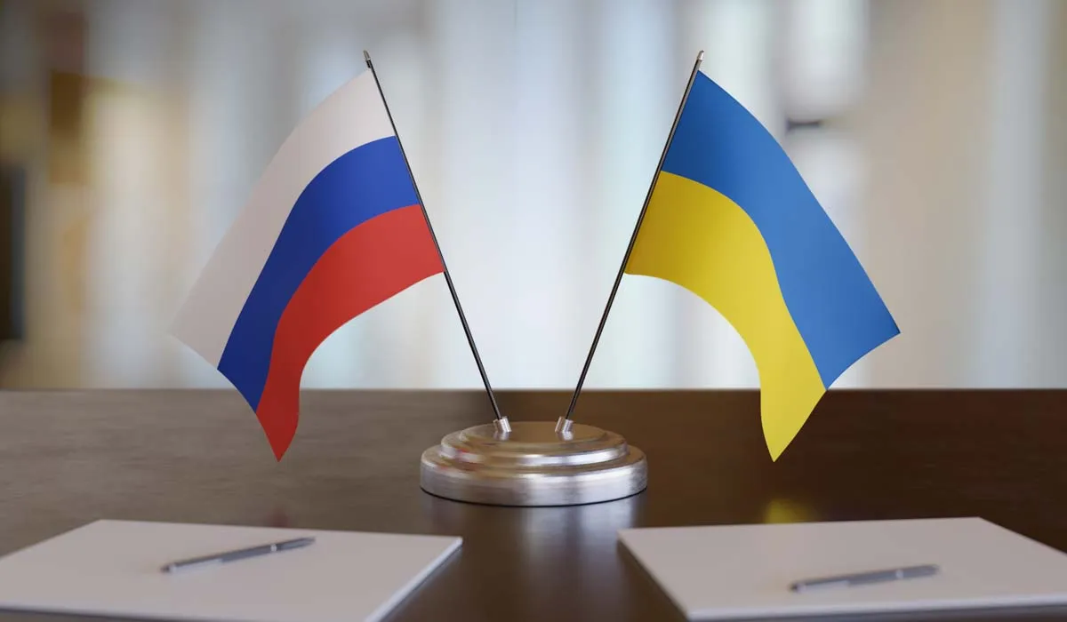 Ukrainian and russian flags on table. Negotiation between Russia and Ukraine. 3D rendered illustration.